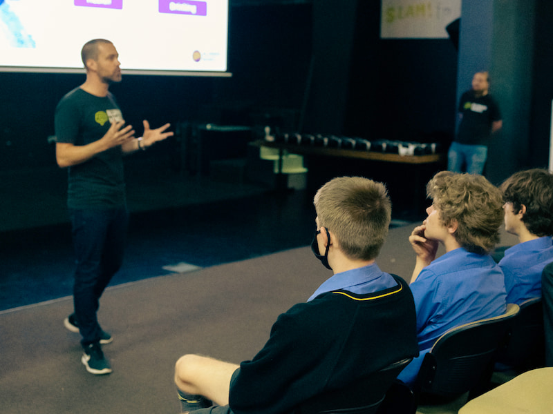 A presenter doing a presentation in front of students