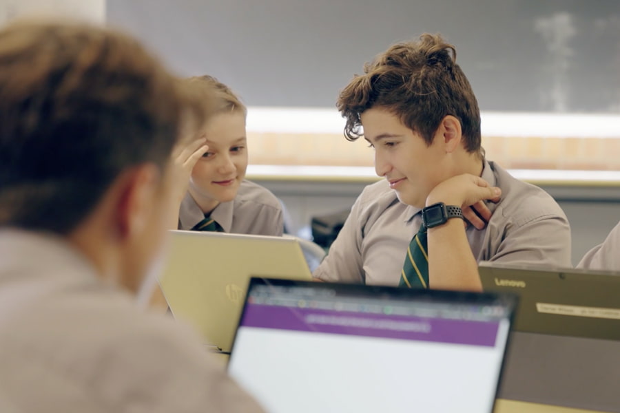 Students using laptops to use Blurred Minds Academy