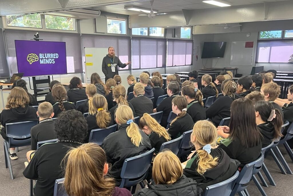 James from Blurred Minds speaking to a class of students